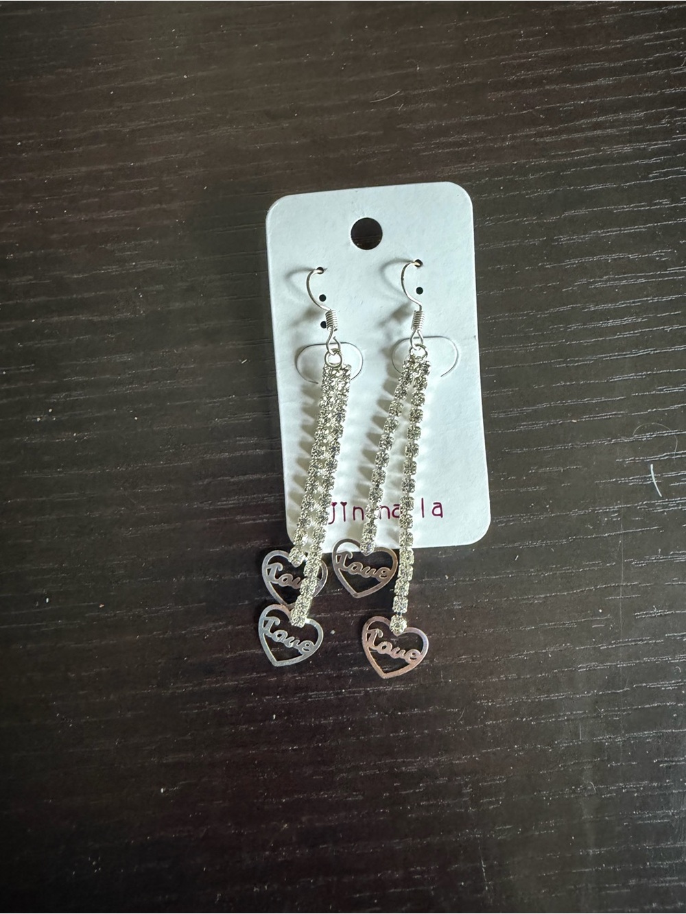 Silver-tone dangle earrings featuring clear rhinestone strands